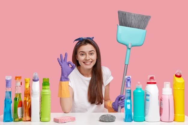horizontal-view-pleased-housemaid-makes-okay-gesture-satisfied-with-result-perfect-cleaning-uses-good-quality-detergents-smiles-broadly_273609-24226